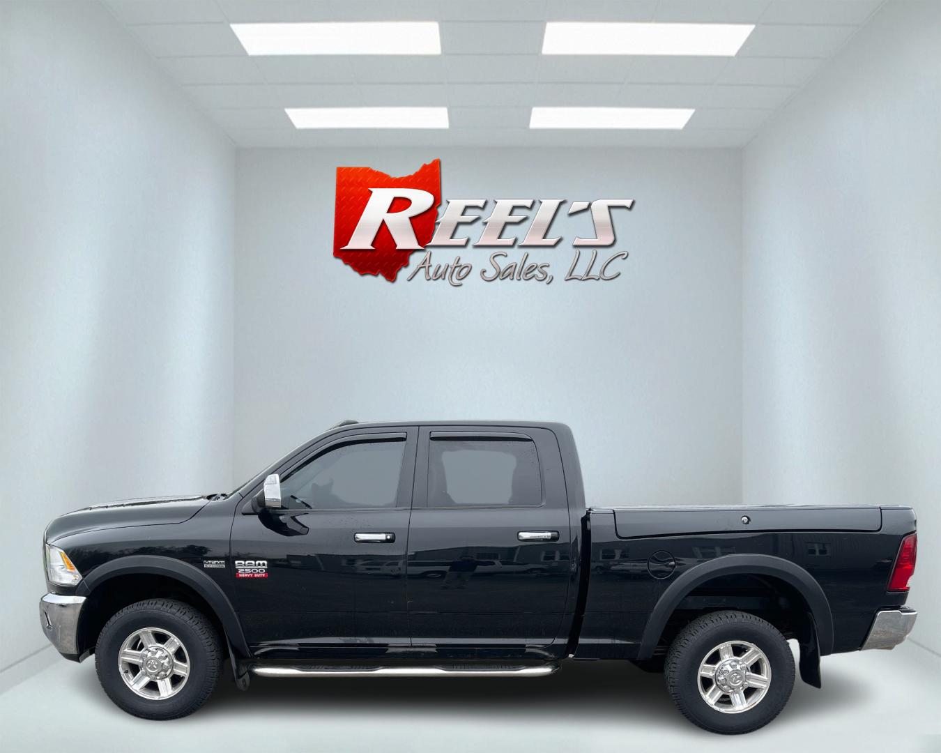 2012 Black /Black Dodge Ram 2500 Laramie Crew Cab SWB 4WD (3C6TD5FT6CG) with an 5.7L V8 OHV 16V engine, 6-Speed Automatic transmission, located at 547 E. Main St., Orwell, OH, 44076, (440) 437-5893, 41.535435, -80.847855 - This 2012 Dodge Ram 2500 Laramie Crew Cab is a heavy-duty pickup truck designed for serious towing and hauling capabilities. Powered by a 5.7L HEMI V8 engine mated to a 6-speed automatic transmission and 3.73 gearing, it boasts an impressive 10,550-pound towing capacity. The interior is well-appoint - Photo#9